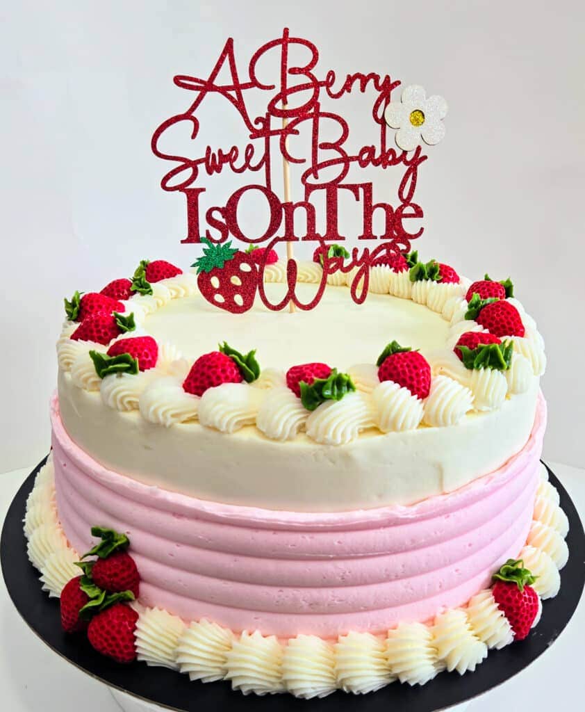 Cake with Strawberries and A Berry Sweet Baby Is on The Way Topper